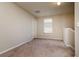 Neutral toned bedroom offers a window for natural light and privacy at 6534 Trent Creek Dr, Ruskin, FL 33573