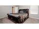 Bedroom with an ornate headboard offers natural lighting at 6534 Trent Creek Dr, Ruskin, FL 33573