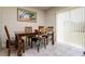 Bright dining area with tile floors features a dining table with seating for four at 6534 Trent Creek Dr, Ruskin, FL 33573