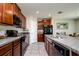 Spacious kitchen features tile flooring, granite countertops, and stainless steel appliances at 6534 Trent Creek Dr, Ruskin, FL 33573