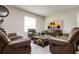 Cozy living room with a large flat-screen TV, plush seating, and a classic coffee table at 6534 Trent Creek Dr, Ruskin, FL 33573