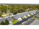 Aerial view of townhomes featuring long driveways and well-maintained landscaping at 6745 Basswood Cir, Zephyrhills, FL 33542
