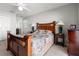Bedroom featuring two side tables, a comfortable bed, and soft lighting at 6745 Basswood Cir, Zephyrhills, FL 33542