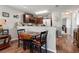 Cozy dining area adjacent to the kitchen, featuring hardwood floors at 6745 Basswood Cir, Zephyrhills, FL 33542