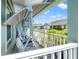 Cozy covered front porch with a swing, offering a relaxing outdoor space at 6745 Basswood Cir, Zephyrhills, FL 33542