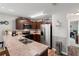 Well-equipped kitchen with ample counter space, modern appliances, and hardwood floors at 6745 Basswood Cir, Zephyrhills, FL 33542