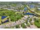 Aerial view showcasing lakes and houses at 7413 Surrey Wood Ln, Apollo Beach, FL 33572