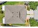 This aerial image showcases the roof, landscaping and driveway at 7413 Surrey Wood Ln, Apollo Beach, FL 33572