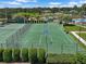 This high angle view showcases the community basketball and tennis courts at 7413 Surrey Wood Ln, Apollo Beach, FL 33572