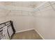 Walk-in closet with carpet and wire shelving at 7413 Surrey Wood Ln, Apollo Beach, FL 33572