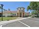 Community clubhouse featuring stone accents, mature trees and convenient parking at 7413 Surrey Wood Ln, Apollo Beach, FL 33572