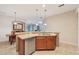 The kitchen features stainless steel appliances and breakfast bar at 7413 Surrey Wood Ln, Apollo Beach, FL 33572