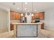 Kitchen area features stainless steel appliances, breakfast bar, and tile flooring at 7413 Surrey Wood Ln, Apollo Beach, FL 33572