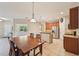Spacious kitchen with stainless appliances, tile floors, and breakfast bar at 7413 Surrey Wood Ln, Apollo Beach, FL 33572