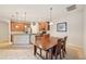 Eat-in kitchen features stainless appliances, tile floor, and an adjacent dining area at 7413 Surrey Wood Ln, Apollo Beach, FL 33572
