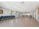 Spacious meeting room with ample seating, neutral tones, and natural light at 7413 Surrey Wood Ln, Apollo Beach, FL 33572