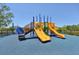 Community playground with colorful equipment and safety surfacing at 7413 Surrey Wood Ln, Apollo Beach, FL 33572