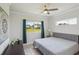Comfortable bedroom with a queen size bed, tile floors, and a view to the backyard at 7504 Carissa, Punta Gorda, FL 33955