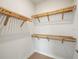 Walk-in closet with wood shelves at 7504 Carissa, Punta Gorda, FL 33955