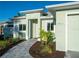 Inviting front entrance with manicured landscaping and a charming walkway at 7504 Carissa, Punta Gorda, FL 33955