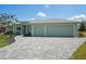 Charming single-story home featuring a two-car garage and beautiful paver driveway at 7504 Carissa, Punta Gorda, FL 33955