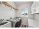 Well-organized laundry room with modern appliances, a sink, and ample counter space at 7504 Carissa, Punta Gorda, FL 33955
