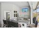 Outdoor bar with a built-in sink, a countertop, and seating area for entertaining at 7504 Carissa, Punta Gorda, FL 33955