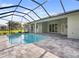 Beautiful pool with a screened lanai, stone patio, and ample space for outdoor entertaining at 7504 Carissa, Punta Gorda, FL 33955