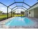 Inviting screened-in pool with a serene outdoor living space and beautiful views of the surrounding landscape at 7504 Carissa, Punta Gorda, FL 33955
