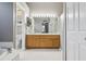 Bathroom featuring dual sinks, tile flooring, and a separate toilet room at 7725 Bingham Ct, Tampa, FL 33625