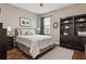 Cozy bedroom with a soft color palette, natural lighting, and a bookcase at 7725 Bingham Ct, Tampa, FL 33625
