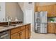 Well-equipped kitchen featuring stainless steel appliances, granite counters, and ample cabinet space at 7725 Bingham Ct, Tampa, FL 33625