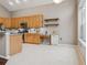 Spacious kitchen featuring stainless steel appliances, granite countertops, and ample cabinet space at 7725 Bingham Ct, Tampa, FL 33625