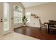 Bright living room with wood floors, tall windows, neutral colors, and minimalist decor for a modern look at 7725 Bingham Ct, Tampa, FL 33625