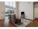 Bright living room with high ceilings, large windows, and a sliding glass door leading to the pool at 7725 Bingham Ct, Tampa, FL 33625