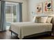 Inviting main bedroom with pool views through sliding glass doors at 7725 Bingham Ct, Tampa, FL 33625