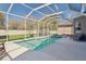 Enclosed pool with a large deck, and outdoor seating and hot tub at 7725 Bingham Ct, Tampa, FL 33625