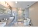 Modern bathroom featuring double sinks, a frameless glass shower, and stylish fixtures and finishes at 777 N Ashley Dr # 3002, Tampa, FL 33602