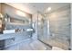 Modern bathroom featuring dual sinks, sleek countertop, and a luxurious glass-enclosed shower at 777 N Ashley Dr # 3002, Tampa, FL 33602