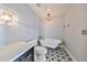 Bright bathroom featuring a vintage clawfoot tub, patterned tile floor, and elegant fixtures at 777 N Ashley Dr # 3002, Tampa, FL 33602