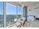 Serene bedroom with floor to ceiling windows, offering panoramic city views and a cozy sitting area at 777 N Ashley Dr # 3002, Tampa, FL 33602