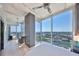 Bedroom offers stunning city views, a ceiling fan, minimalist decor, and access to a balcony at 777 N Ashley Dr # 3002, Tampa, FL 33602