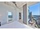 Bright bedroom with expansive windows and city views, featuring modern ceiling fan and concrete ceiling at 777 N Ashley Dr # 3002, Tampa, FL 33602