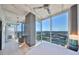 Bedroom offers stunning city views, a ceiling fan, minimalist decor, and access to a balcony at 777 N Ashley Dr # 3002, Tampa, FL 33602