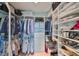Organized walk-in closet with ample shelving, hanging space, and storage drawers, perfect for clothing at 777 N Ashley Dr # 3002, Tampa, FL 33602