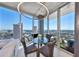 Dining area boasts expansive city views, a glass table, and stylish seating beneath a modern light fixture at 777 N Ashley Dr # 3002, Tampa, FL 33602