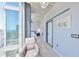 Bright hallway with a sliding barn door, modern decor, and a view of the bedroom and city skyline at 777 N Ashley Dr # 3002, Tampa, FL 33602