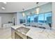 Modern kitchen with views, stainless steel sink and fixtures with marble countertops at 777 N Ashley Dr # 3002, Tampa, FL 33602