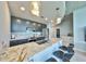 Stylish kitchen with marble countertops, stainless steel appliances, and bar seating at 777 N Ashley Dr # 3002, Tampa, FL 33602