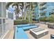 This patio has a built in firepit with an L shaped lounge, a beautiful space to entertain your guests at 777 N Ashley Dr # 3002, Tampa, FL 33602
